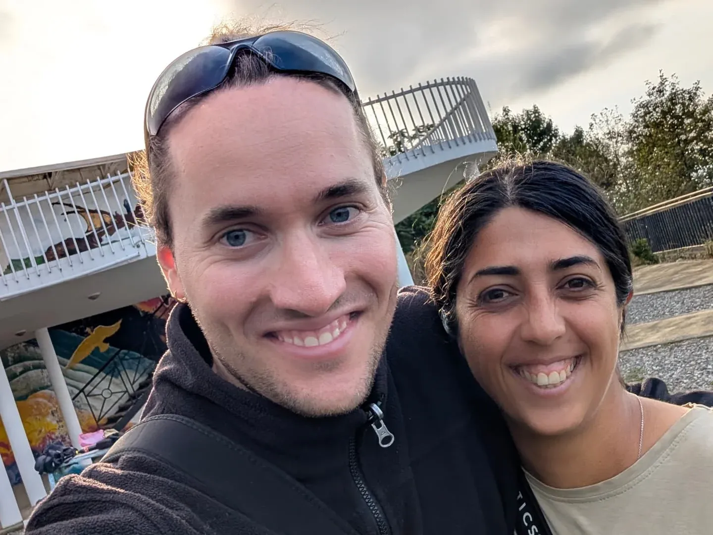 Two smiling counters taking a selfie outside at Station 1.