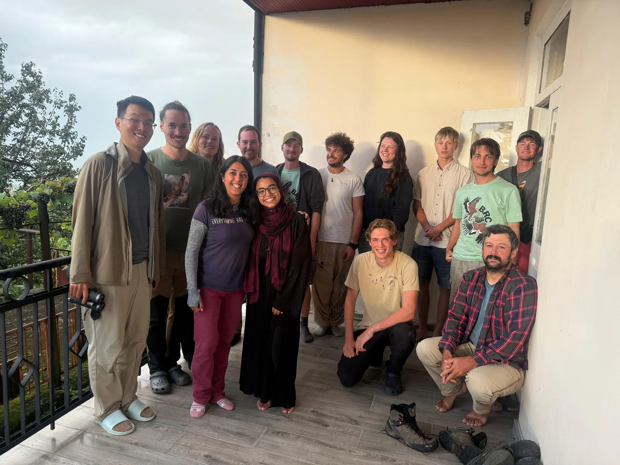 BRC volunteers posing together on a balcony.