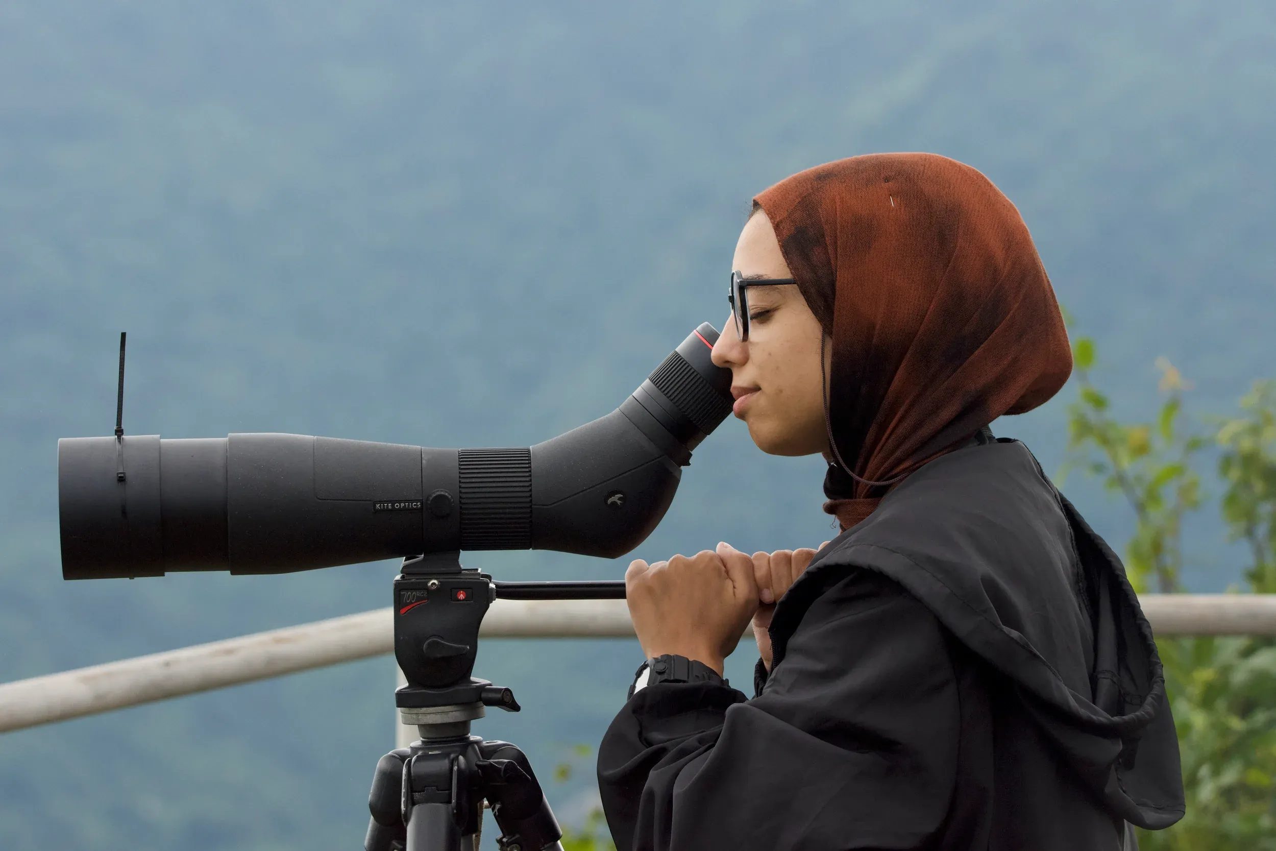 A trainee looking through a spotting scope at the count platform